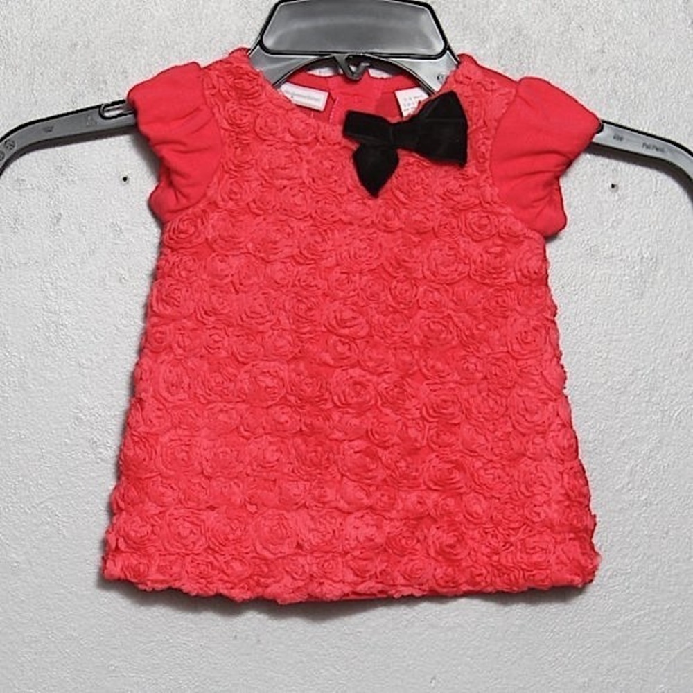 First impressions pink black textured rosette top
